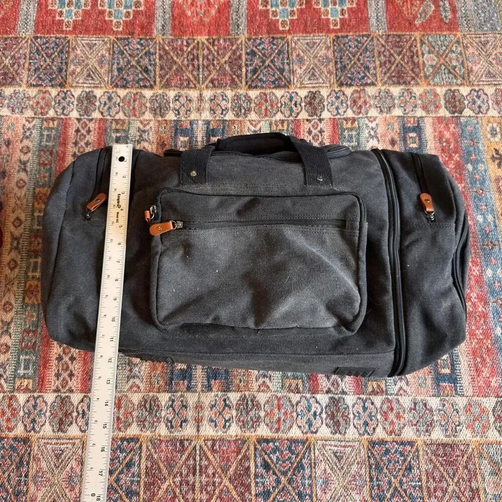 Sucipi Black canvas duffle bag with leather accents